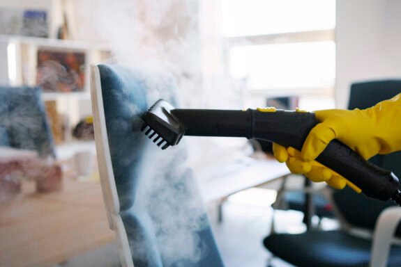 professional-cleaning-service-person-using-steam-cleaner-office